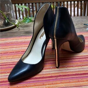 BCBGeneration high back black heels with gold stripe. NWOT